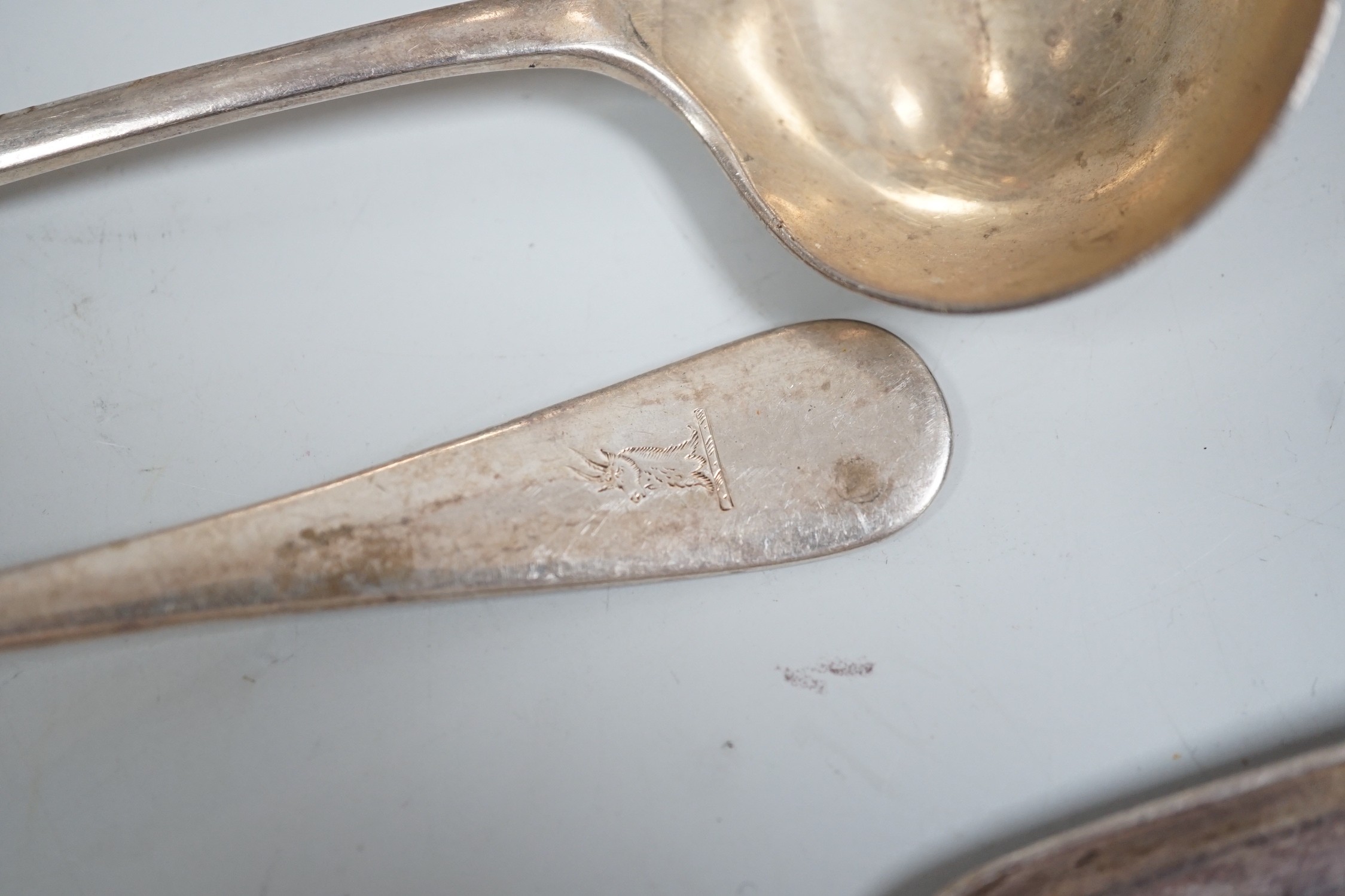Mixed silver and plated ware including a Victorian silver Kings pattern soup ladle, London, 1857, a George III silver marrow scoop, London, 1789, a pair of later Old English pattern sauce ladles, a sterling bonbon dish,